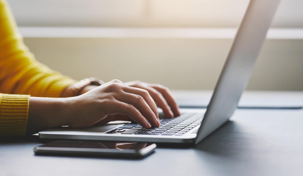 Person typing on a laptop