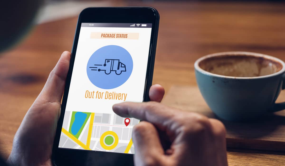 What is track and trace? Person with track and trace function on smartphone